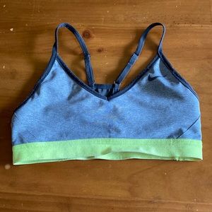 Gray Nike sports bra with neon yellow band.